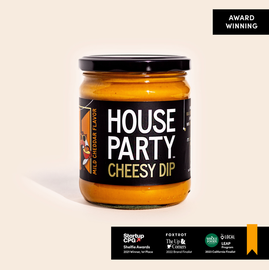 jar of house party cheesy dip orange sauce with black label on white background