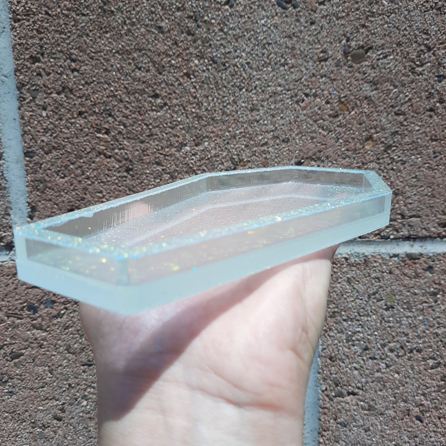 handcrafted vegan soap bar organic oils
on wood soap dish
with moon background spooky dark apothecary style
in bathroom on tile