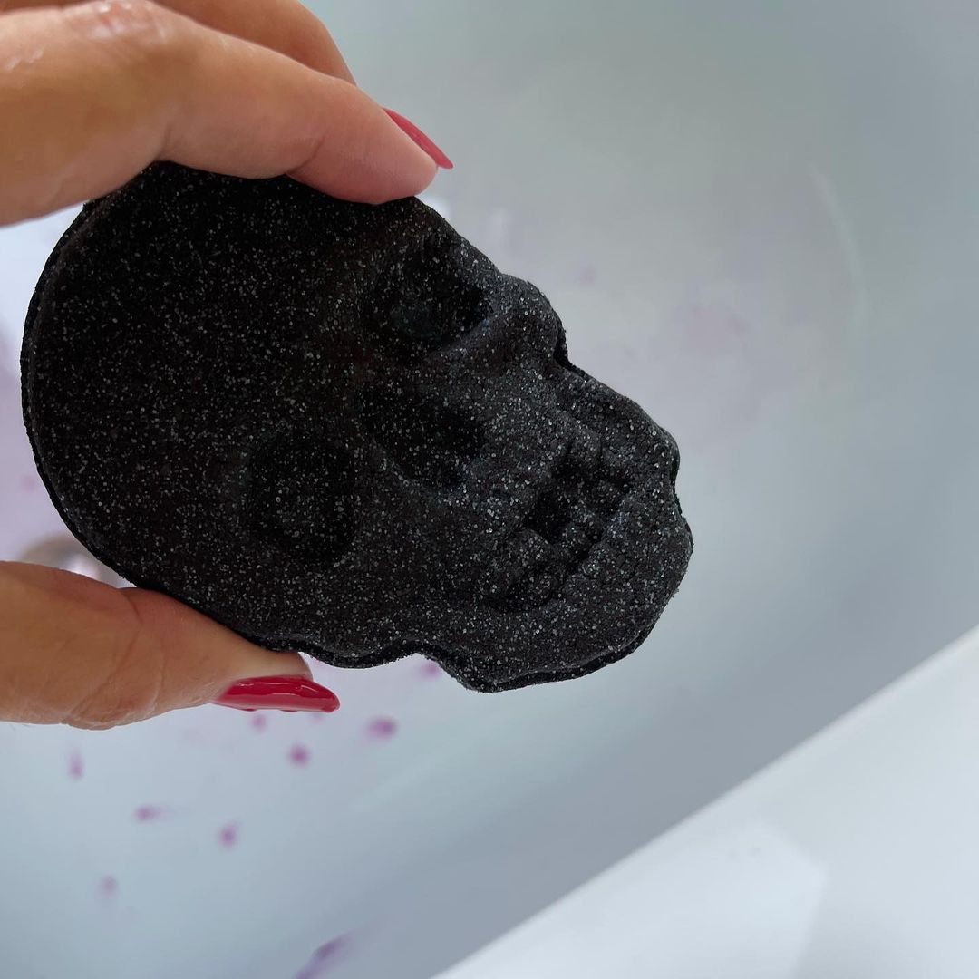 full bath tub with bath fizz going in