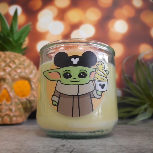 picture of yellow candle with twinkle lights and pineapple skull